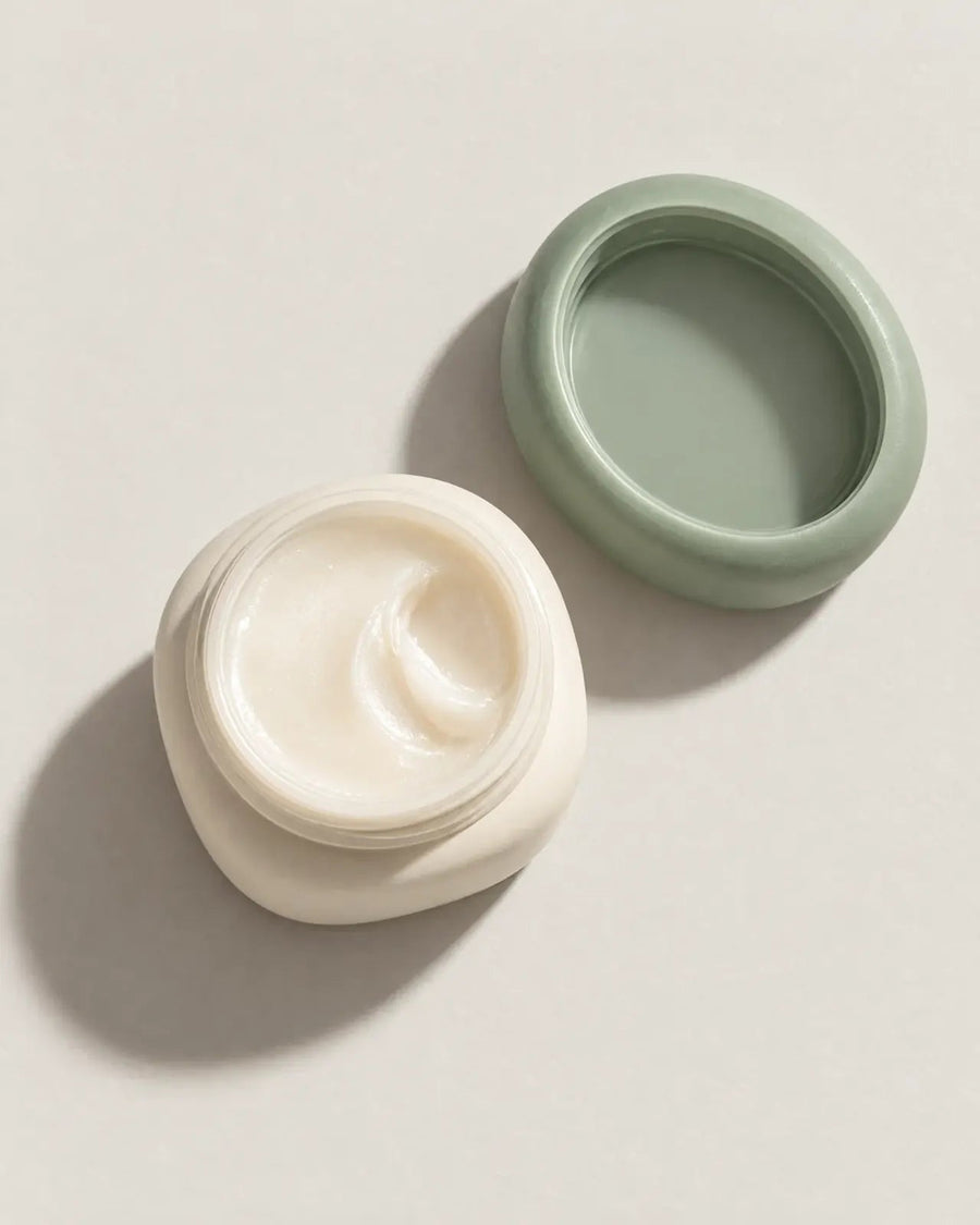 A hand scooping Water Cream