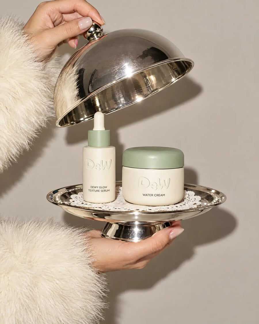 Serum and Water Cream under a silver cloche